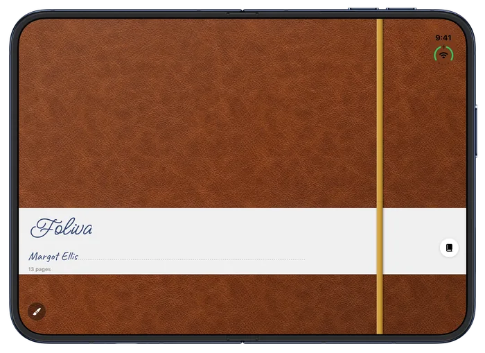 iPhone Duo: a closed notebook in cognac leather with a gold band and the Foliva label